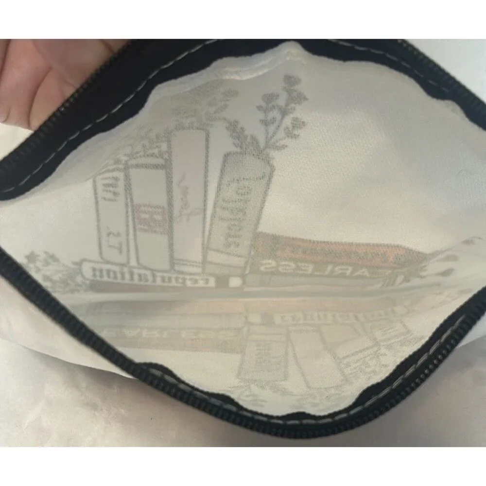 White and Black Cosmetic Bag with Books Design